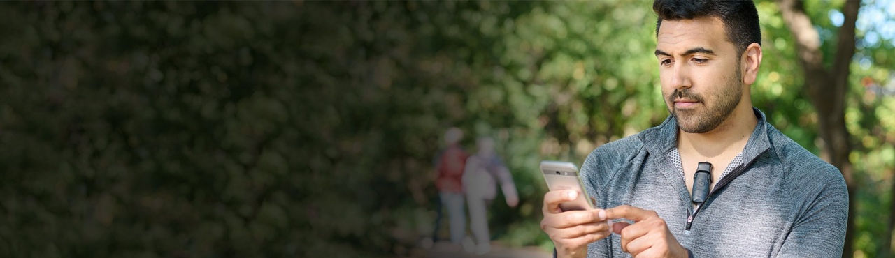 Teaser banner showing man using mobile phone while wearing BodyGuardian
