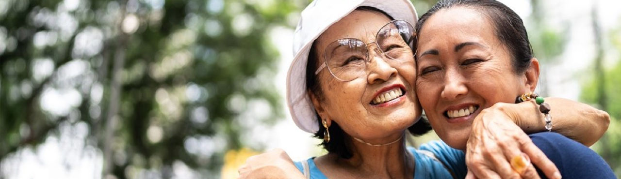 Teaser banner happy mother and daughter embracing outside