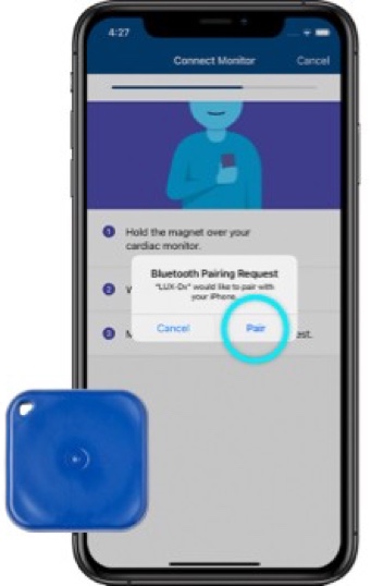 iPhone showing a bluetooth pairing pop-up with the pair button highlighted