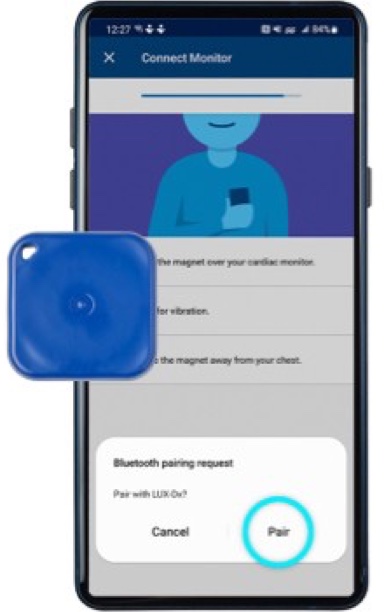 Android phone showing a bluetooth pairing pop-up with the pair button highlighted