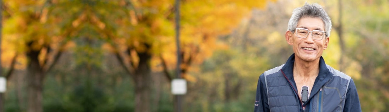 Hero banner showing smiling older man enjoying the outdoors while wearing BodyGuardian